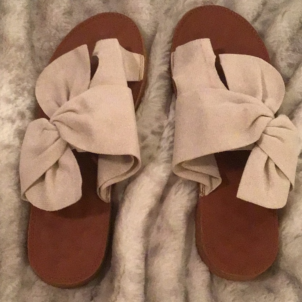 Cream slide sandals. Toe has its own hole. These are really comfy.